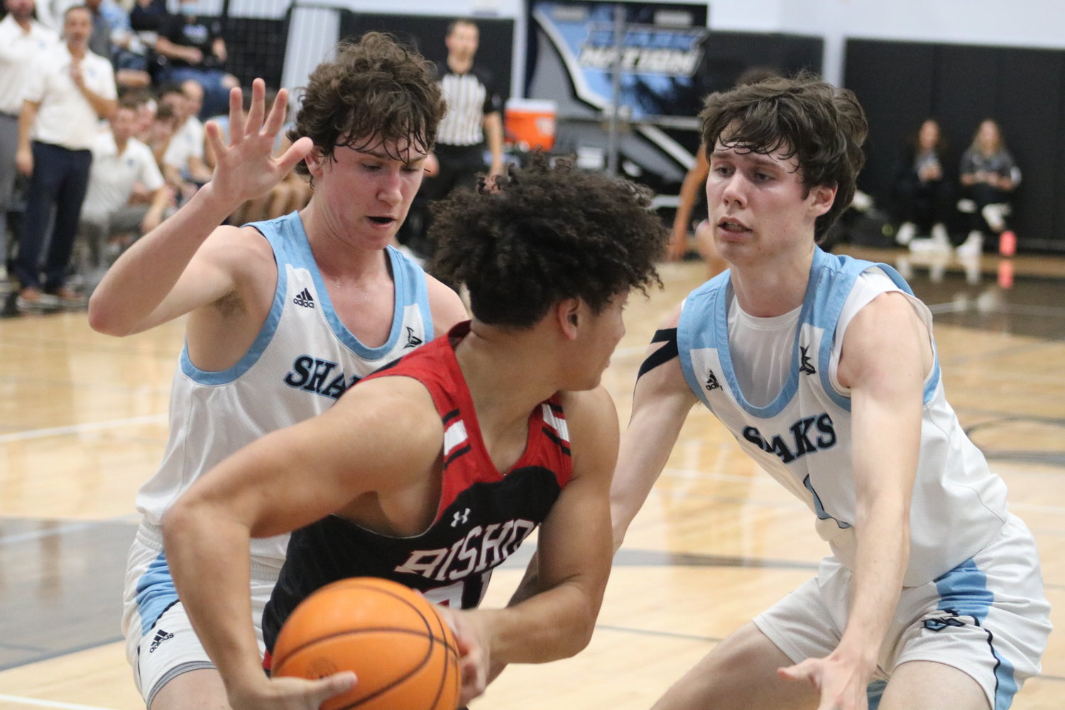 Ponte Vedra’s J.T. Kelly and Gus Jordheim trap a Bishop Kenny ball handler in the back court. Pressure defense was key to the Sharks’ success.